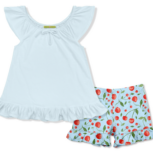 Light blue top and cherry-patterned shorts on a white background, front