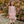 A young girl wearing an a deer and floral printed a-line dress with patch pockets  and matching stripe leggings