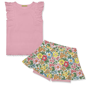 Girls pink ribbed top with ruffle detail and matching floral skort on a white background, front.
