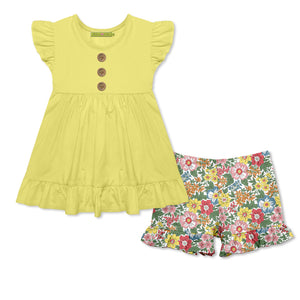 Girls yellow top with ruffle detail and matching floral shorts on a white background , front.