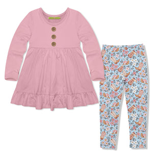 A girl's two-piece outfit set featuring a dusty pink long-sleeve top with three wood buttons and a ruffled hem, paired with light blue leggings covered in a brown swestern boot themed pattern.