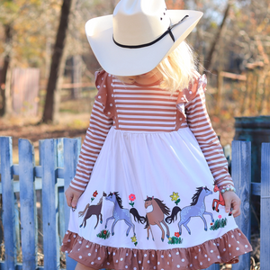 A young girle wearing a Long Sleeve Khaki Dress with a printed pony border and dot trim,outside, lifestyle, Millie Loves Lily