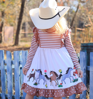 A young girle wearing a Long Sleeve Khaki Dress with a printed pony border and dot trim,outside, lifestyle, Millie Loves Lily