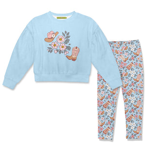 A children's two-piece outfit set featuring a light blue velour sweatshirt with a western-themed floral and boot graphic, paired with matching patterned leggings.