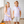 A girl wearing a lilac halloween themed printed dress and a boy wearing a lilac and white striped polo with a pumpkin on the left chest and khaki shorts standing on a porch, lifestyle- Millieloveslily.com
