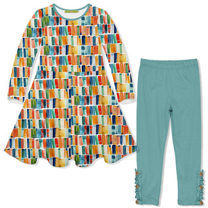 A two-piece children's outfit set featuring a long-sleeve dress with a colorful watercolor-style striped pattern, paired with matching teal leggings that have decorative ruffle details at the cuffs.