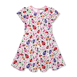Children's dress with ladybug pattern on a white background