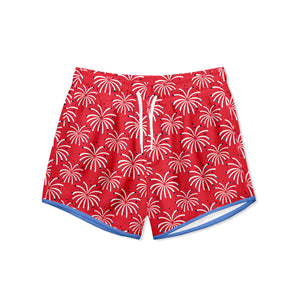 Boys red swim shorts with white fireworks pattern on a white background, front