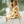 Young girls wearing a yellow  & Cream Sunflower dress  sitting on a dock, lifestyle, side- Millieloveslily.com