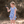 Young girl wearing a  Periwinkle Butterfly Printed Top and Solid Short holding a butterfly, lifestyle