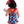 A young girl wearing a red,white & blue pospsicle print 1-pc swimsuit with red dot ruffles and and red bow, back
