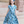 A young girls wear a  Teal Floral Hi - Low Midi Dress with short sleeves standing in front of steps outside, lifestyle - Millieloveslily.com