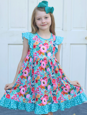 Young girl wearing a  Turquoise  Floral Angel Sleeve Dress and turquoise hair bow standing in front of a white background, front-Millieloveslily.com
