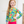 A young girl wearing a yellow & fuschia  Hawaiian tropical pattern Long Sleeve Rashguard and swim short Set, standing in front of a white background, lifestyle UPF 50+, 