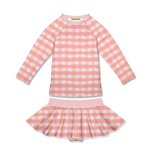 girls rash guard and skirted swim bottom in pink and orange checkered on a white background, front