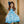 A young girl wearing a  Blue butterfly & Floral printed Angel - sleeve Dress - Millieloveslily.com