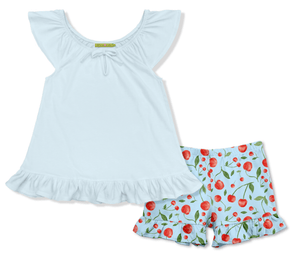 Light blue top and cherry-patterned shorts on a white background, front