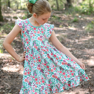 Kids Jade Meadow Flower Angel - Sleeve Dress, outside in a wooded area, front- Millieloveslily.com
