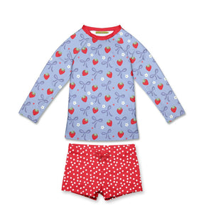 girls two piece rashguard set with a strawberry themed print rashuard and dot swim shorts on a white background, front