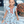 A young girl standing outside wearing a  Rodeo themed  Ruffle Front Angel - Sleeve Dress - Millieloveslily.com