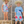 A young boy and girl wearing matching blue barn amimal themed swimsuits wearing strawhats, lifestyle, front- Millieloveslily.com