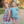 2 young girls wearing matching prints. One wearing a kitten & floral printed dress and the other wearing a kitten and floral printed bike short with matching cotton top standing outside Millieloveslily.com
