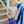 Boy wearing Red, Wht, & Blue Popsicle print Swim Shorts standing in front of a pool, front
