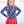 young girl wearing a  long sleeve  rashguard  in Red,Wht,Blue Stars & Skirty Bottom with red polka dots standing outside, lifestyle,front